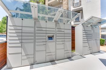 A modern LUXE branded outdoor shower with a glass enclosure.